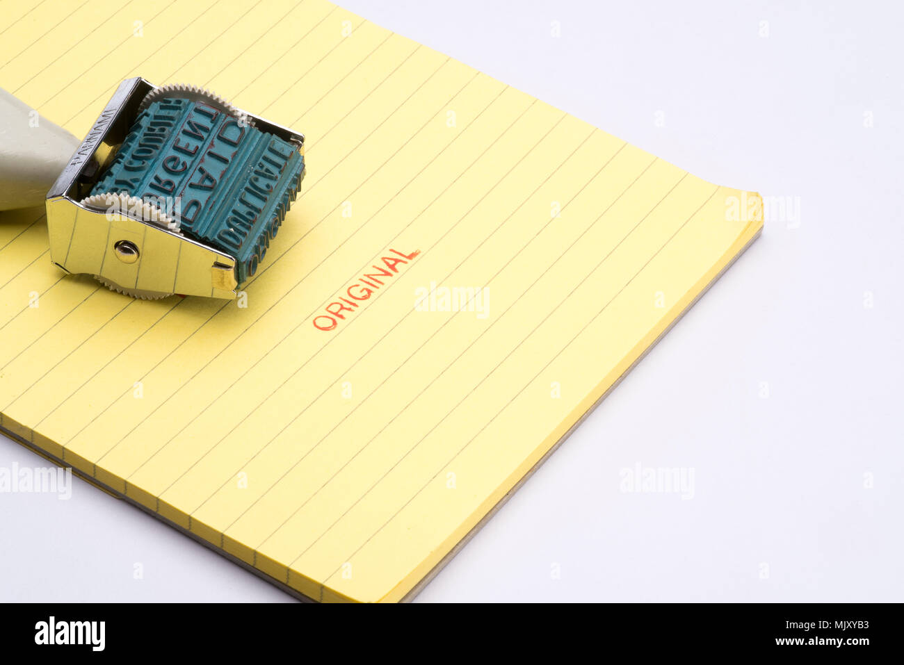 " Originale " timbro di gomma sulla carta gialla notepad Foto Stock