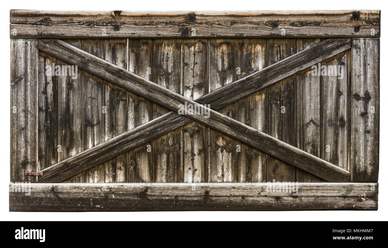 Rurale antico cancello di legno in una cornice fatta di stecche. Vintage texture a strisce dal fienile porta con una croce da listelli. Isolato su sfondo bianco. Foto Stock