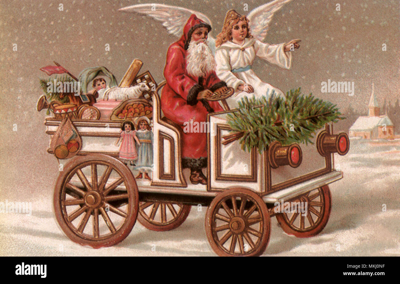 Santa e Angelo in auto Foto Stock