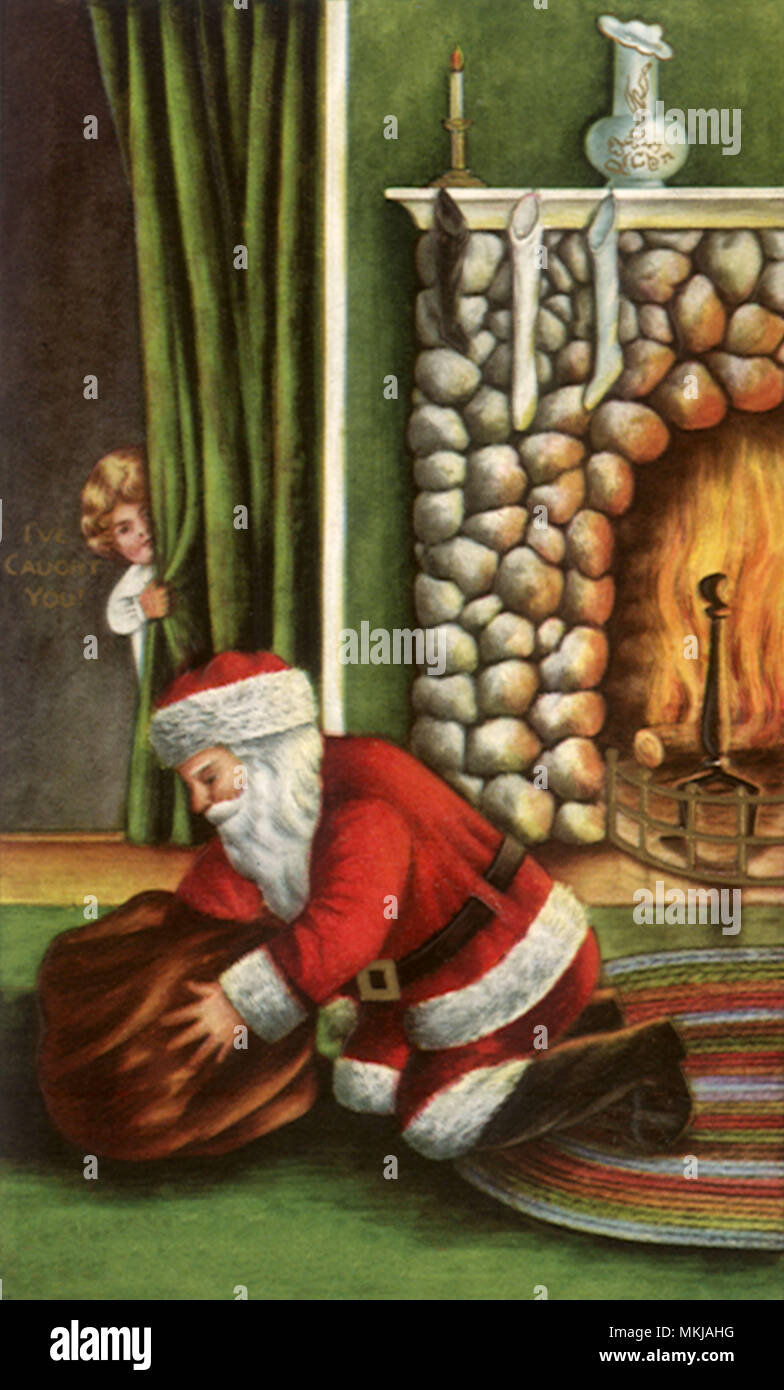 Santa inginocchiato dal fuoco Foto Stock