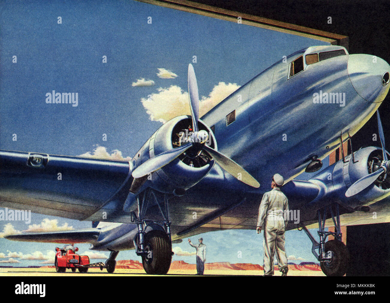 Piano entrando in hangar Foto Stock