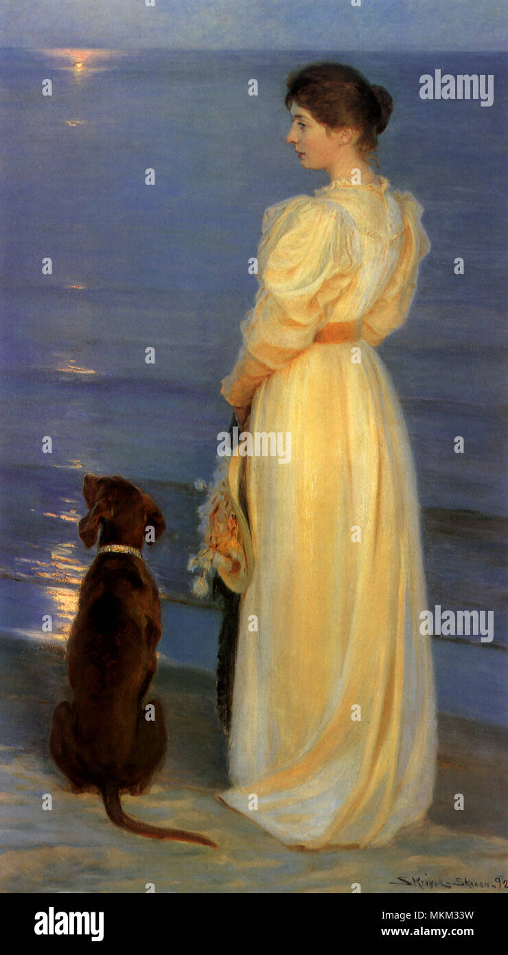 Donna e cane sulla spiaggia Foto Stock