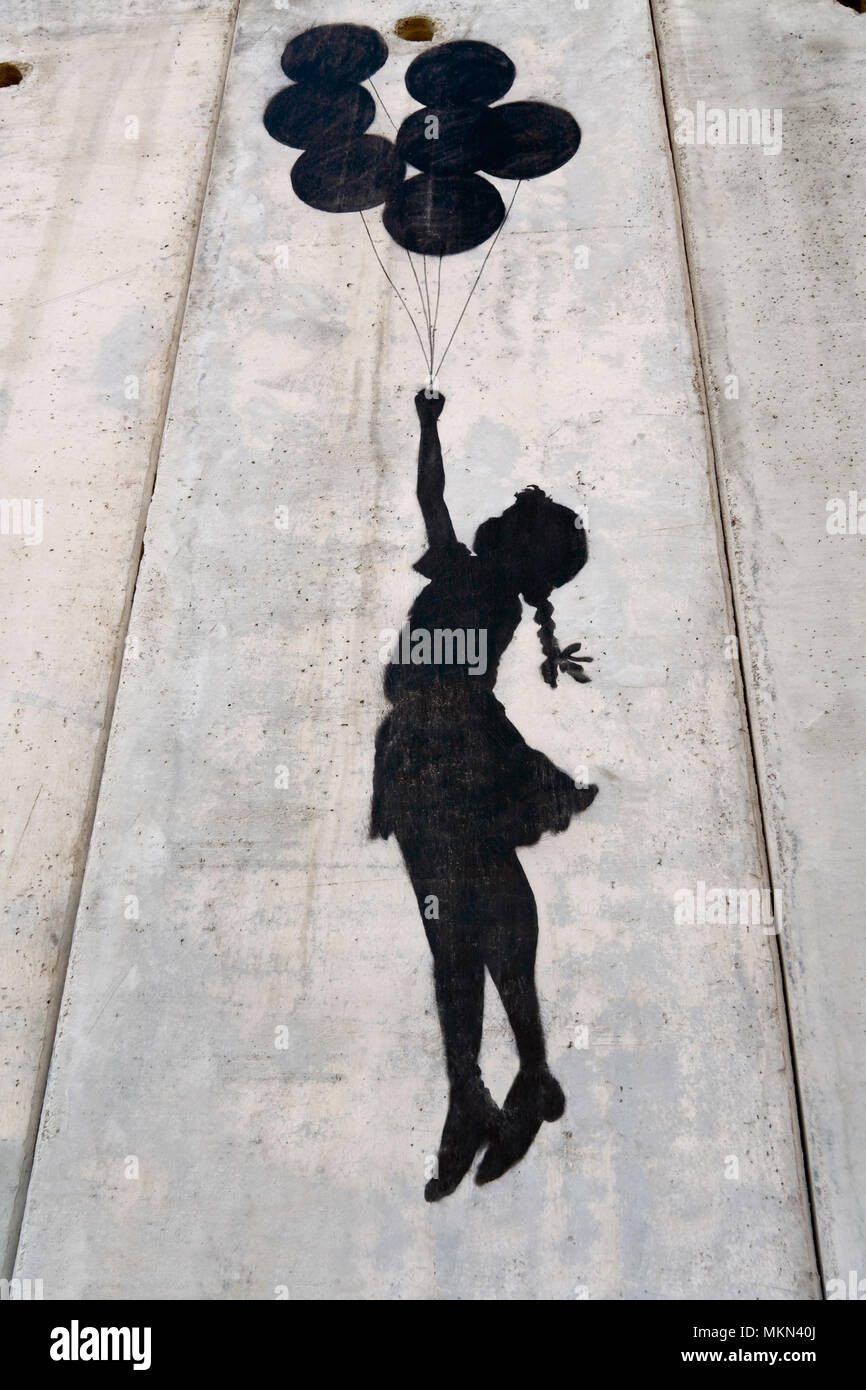 Un banksy graffiti sulla parete di separazione, Palestina Foto Stock