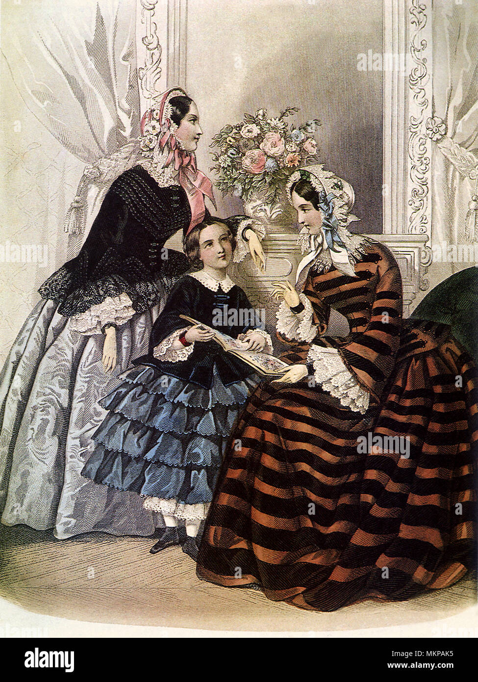 Due donne e una ragazza in francese crinolina abiti Foto Stock