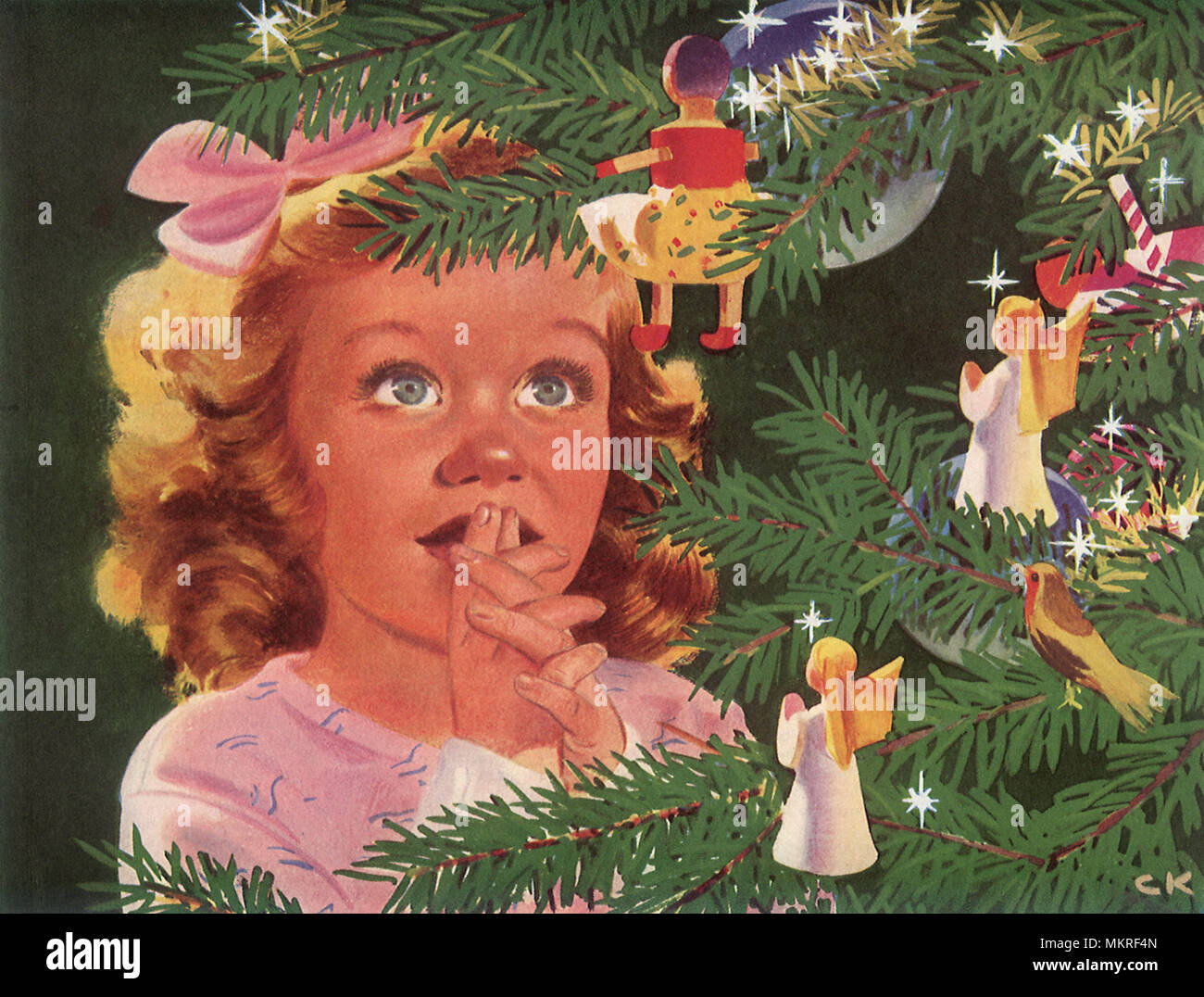Piccola ragazza adora il Natale ornamenti Foto Stock