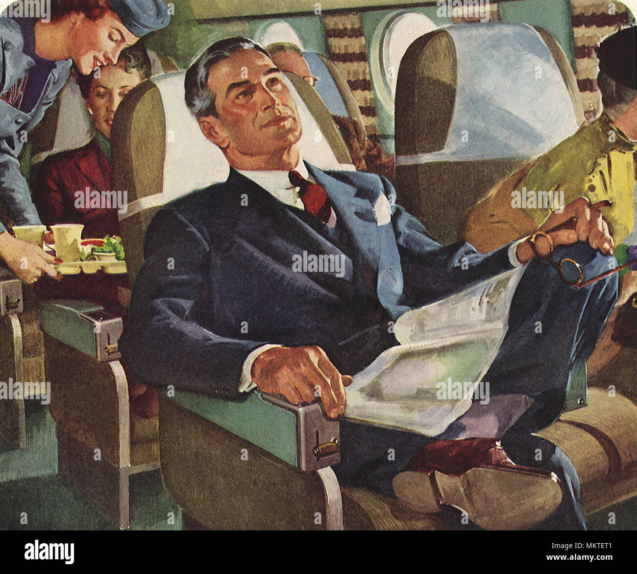 Imprenditore si rilassa su aereo Foto Stock