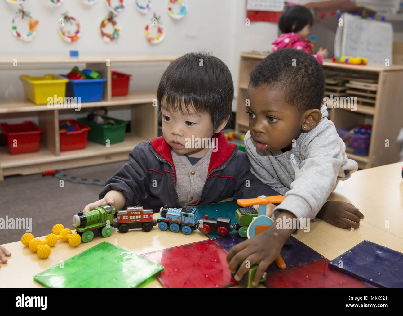 Lower East Side multi etnico scuola materna nel quartiere di Chinatown di Manhattan. Foto Stock