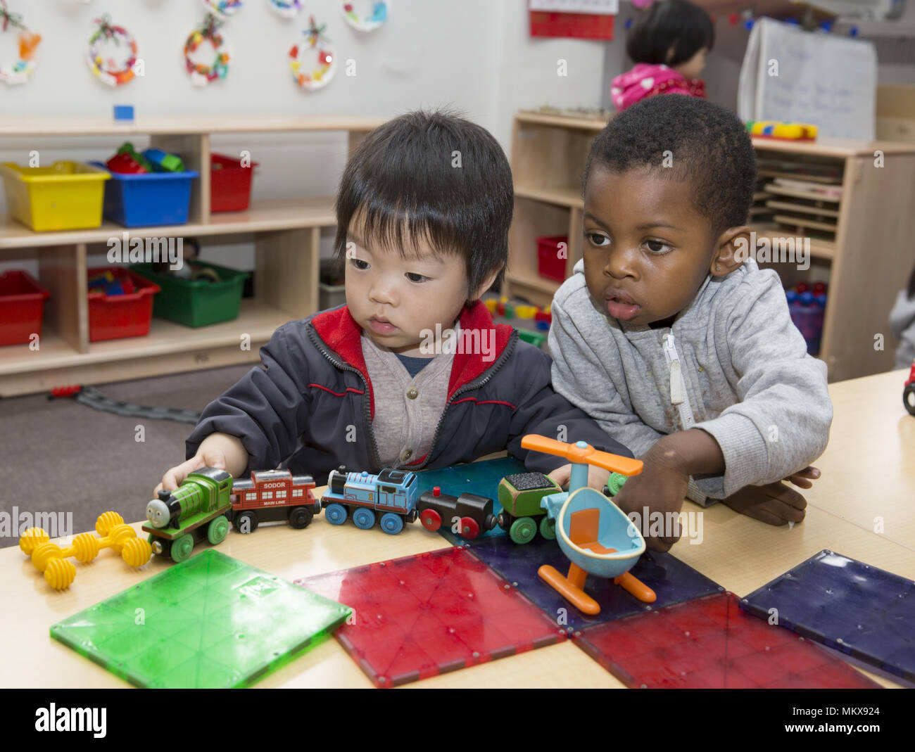 Lower East Side multi etnico scuola materna nel quartiere di Chinatown di Manhattan. Foto Stock