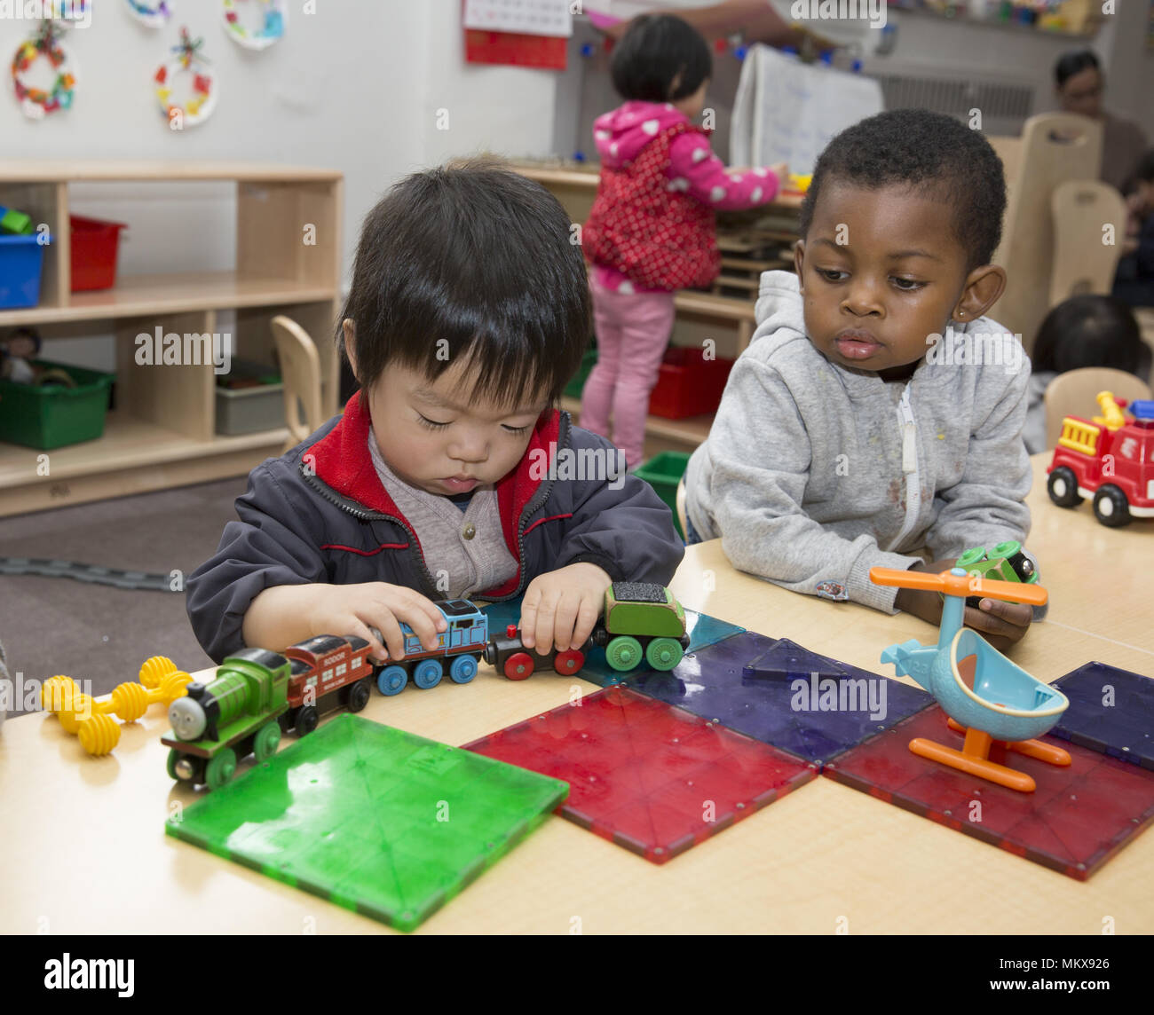 Lower East Side multi etnico scuola materna nel quartiere di Chinatown di Manhattan. Foto Stock