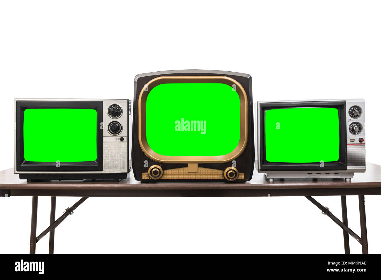 Tre televisori vintage isolato su bianco con chroma key green schermate e percorso di clipping. Foto Stock