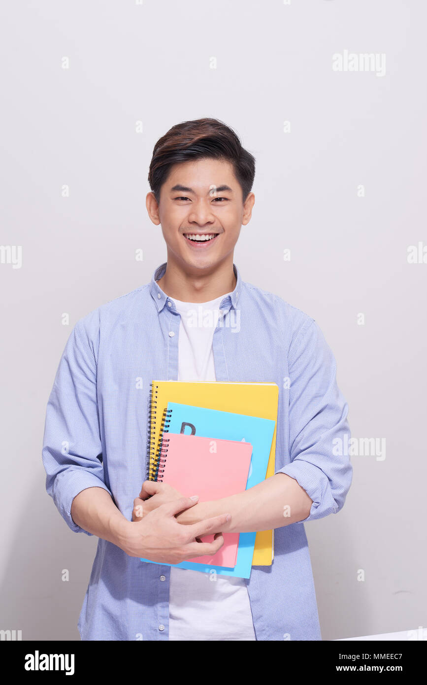 Fiducioso asian bello studente libri di contenimento Foto Stock