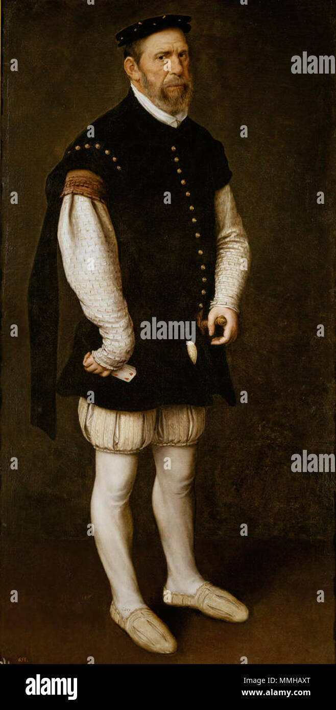 . Il lavoro è elencato nel 1600 inventario di Madrid del palazzo Alcazar come "Pejerón, il pazzo del conte di Benavente, con calze bianche e jerkin e un mazzo di carte nella sua mano destra". Essa è stata mantenuta nel tesoro. Mor probabilmente ha reso questo lavoro durante la sua ultima visita in Spagna nel 1559. Il giullare appare a tutta lunghezza, in piedi, con uno sfondo scuro e senza riferimenti spaziali. Come egli occupa tutto lo spazio disponibile in primo piano è difficile conoscere la sua vera altezza. Egli è sontuosamente vestito in abiti cortese, e solo la sua testa grande, gambe corte e deformata in mano - le carte che detiene s Foto Stock