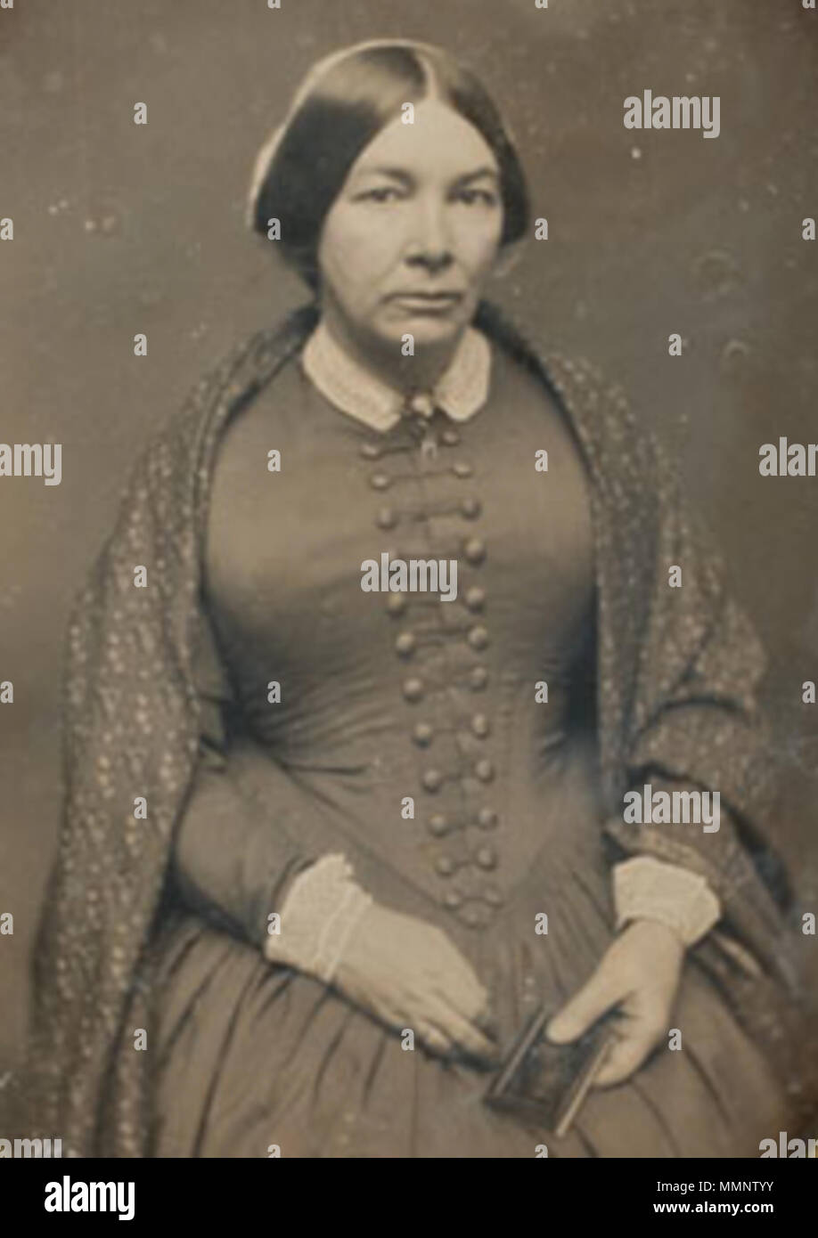 . 'Un daguerreotype Ritratto di signora seduto, tenendo un piccolo album o daguerreotype caso nella sua mano sinistra, indossando un anello di nozze sul suo dito e uno scialle modellato sulle sue spalle, con gennaio 17th, 1852 graffiato lungo la parte inferiore sinistra perimetro dove la piastra incontra il tappetino e nuovamente graffiato lungo angoli inferiori destro e sinistro sotto il tappetino, Cooley Springfield timbro su mat' 8 1852 donna ritratto byCooley Springfield Foto Stock
