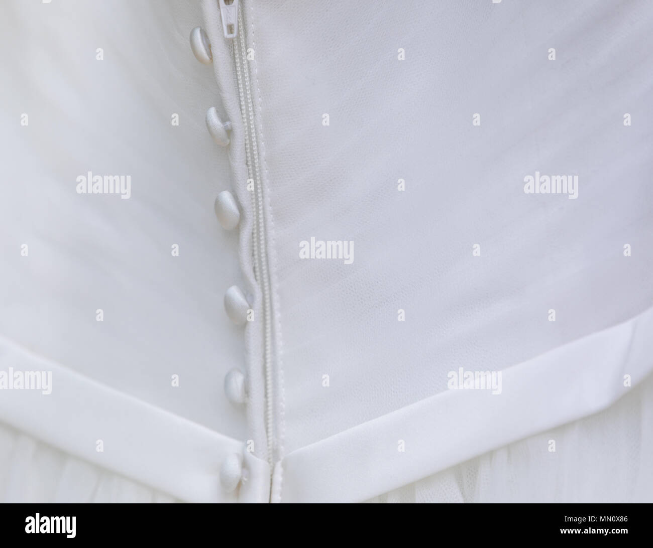 Dettaglio immagine del retro di un abito da sposa Foto Stock