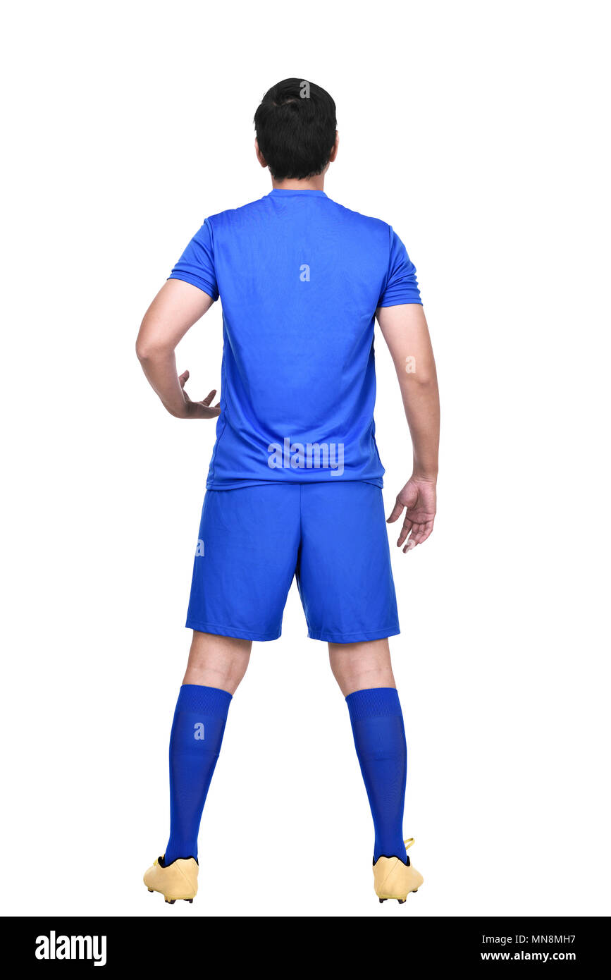 Vista posteriore di asian giocatore di calcio in maglia blu in piedi isolato su sfondo bianco Foto Stock