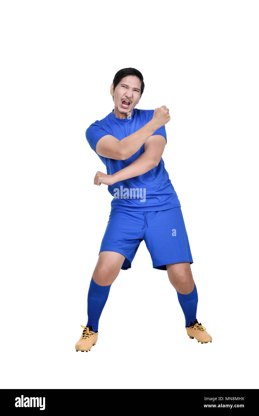 Attraente asian giocatore di calcio con espressione eccitata isolate su sfondo bianco Foto Stock