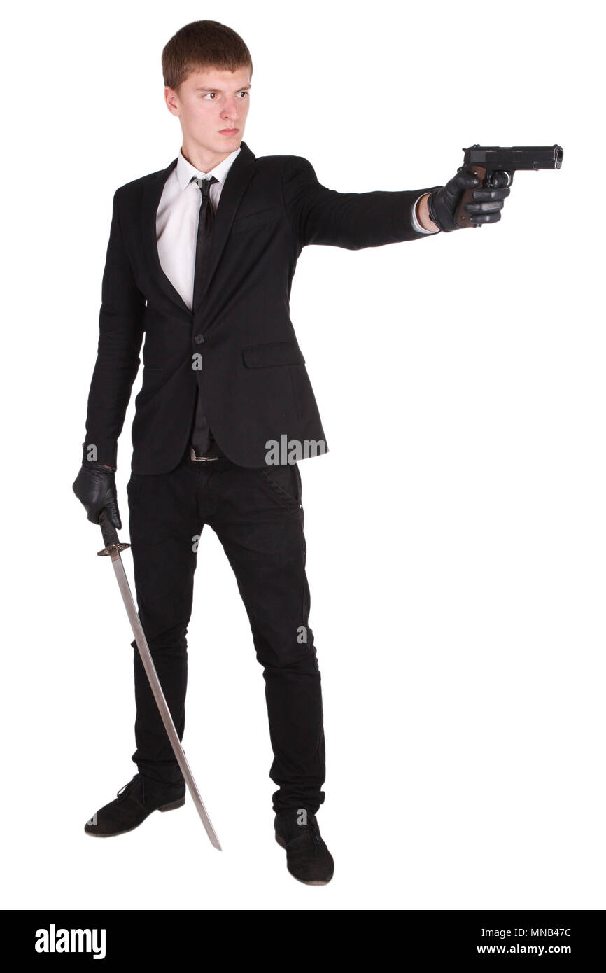 Uomo in costume nero e spada katana isolato su bianco Foto Stock