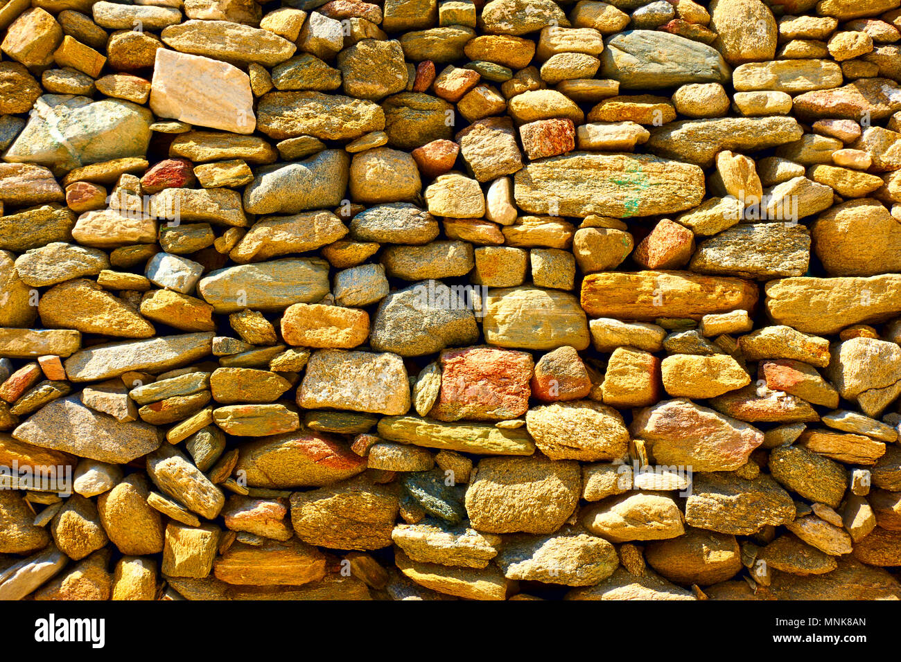 Muratura da ruvida ciottoli, può essere utilizzato come sfondo Foto Stock