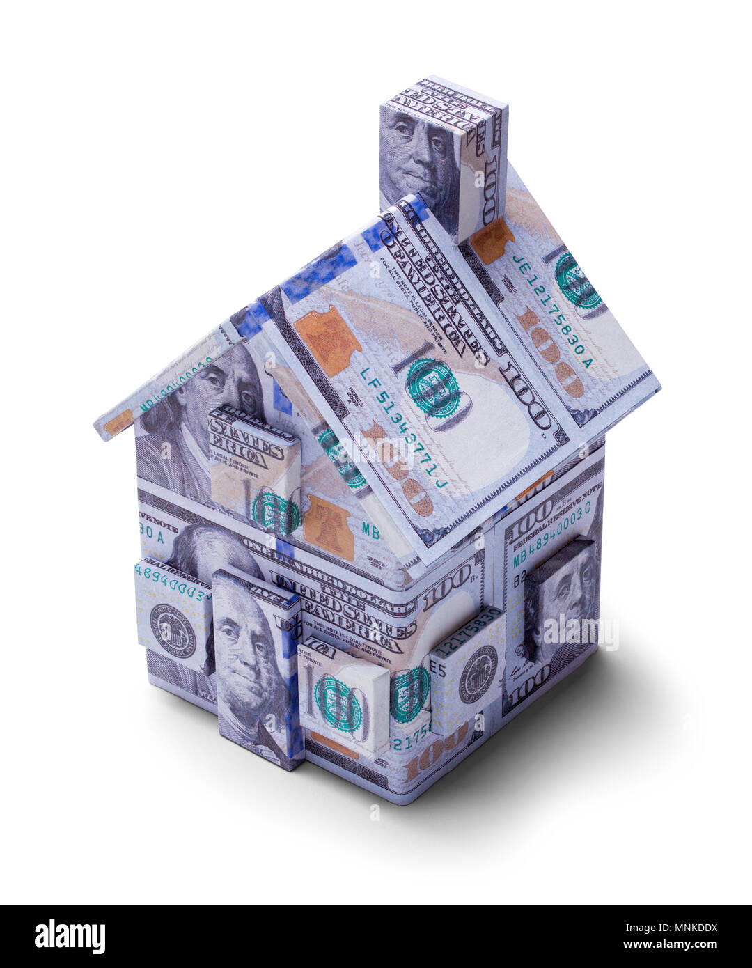 Casa coperte sulle banconote da cento dollari isolato su uno sfondo bianco. Foto Stock