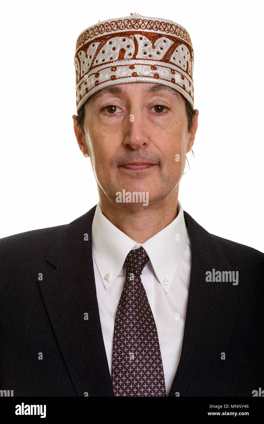 Close up di maturo imprenditore indossando tradizionale etnica hat Foto Stock