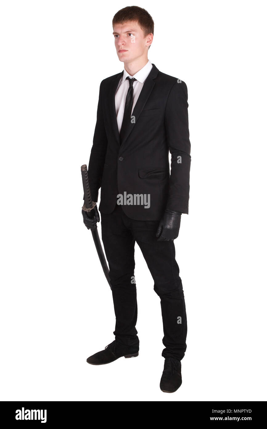 Man in black suit e spada katana isolato su bianco Foto Stock