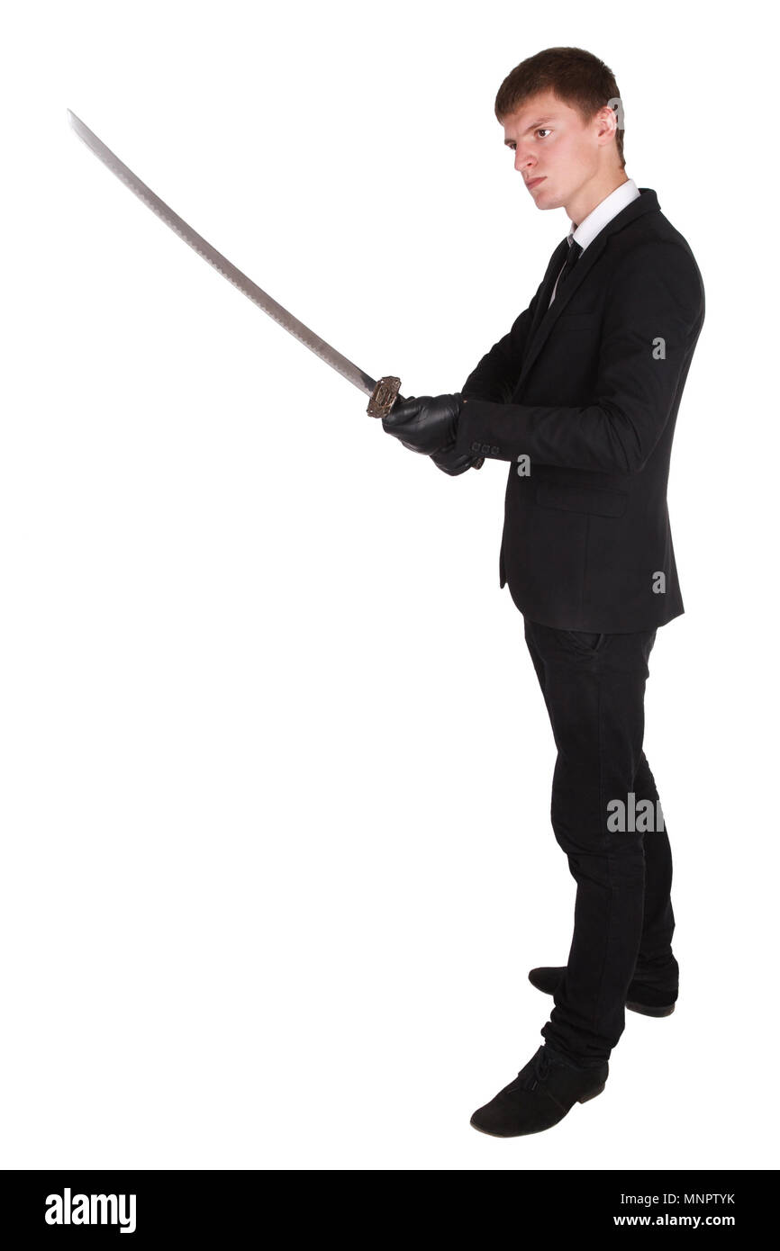 Man in black suit e spada katana isolato su bianco Foto Stock