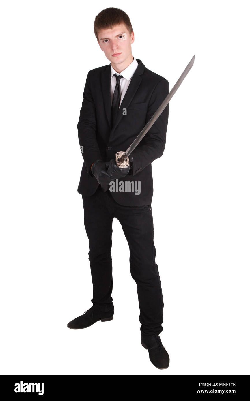 Man in black suit e spada katana isolato su bianco Foto Stock