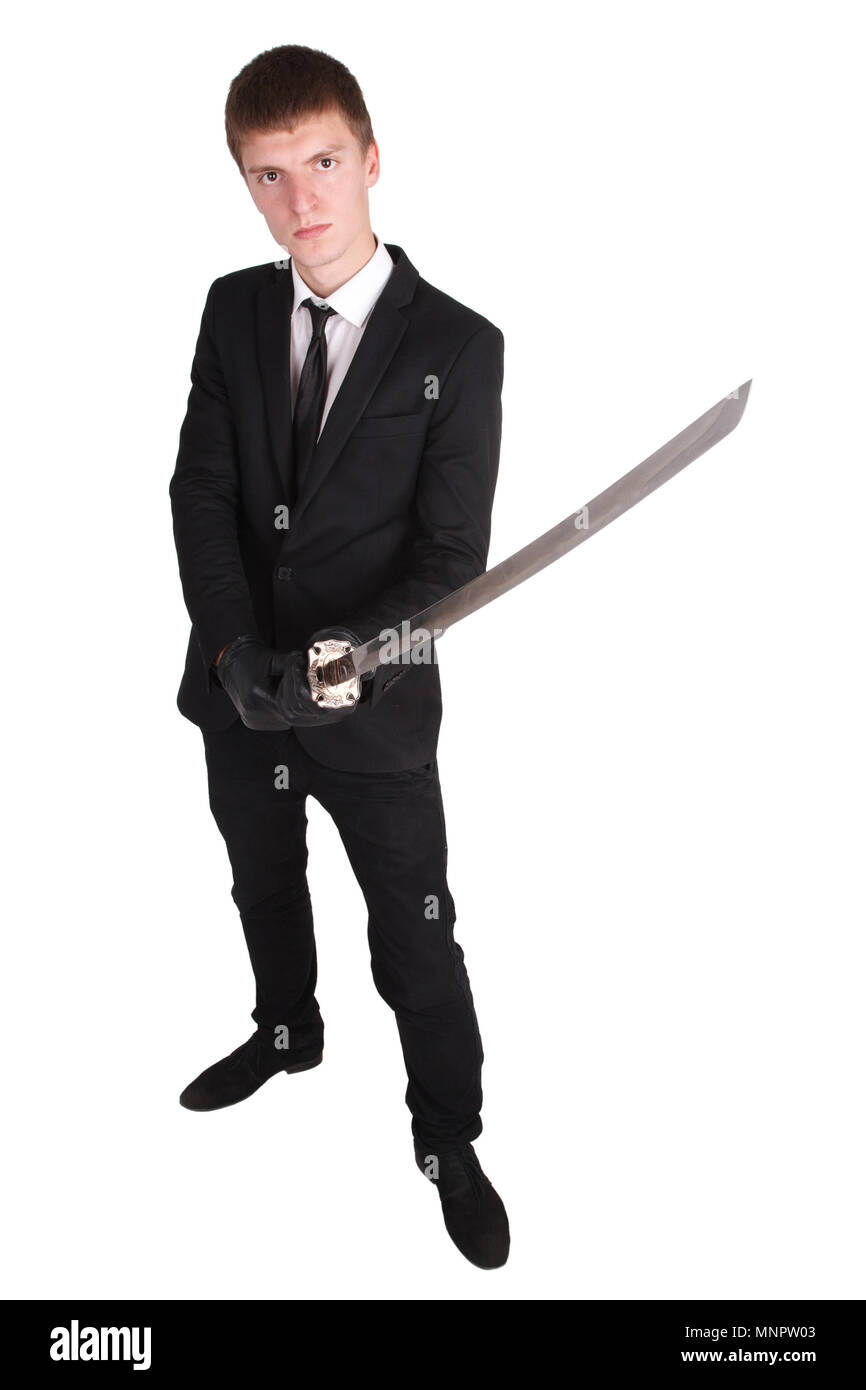 Man in black suit e spada katana isolato su bianco Foto Stock