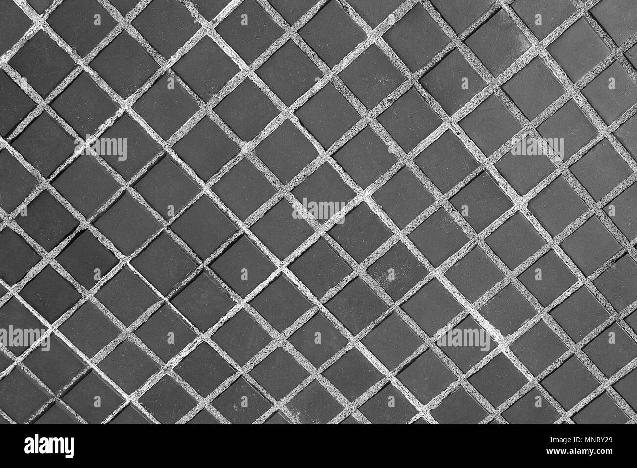 Pietra di sfondo sul marciapiede o texture in bianco nero Foto Stock