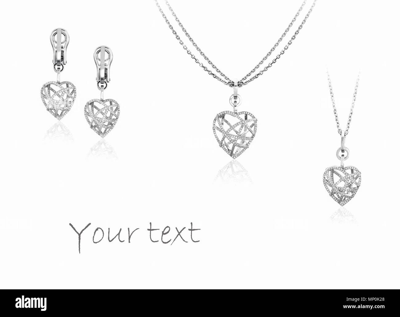 Set di lusso di ciondolo a forma di cuore Orecchini con diamanti su sfondo bianco Foto Stock
