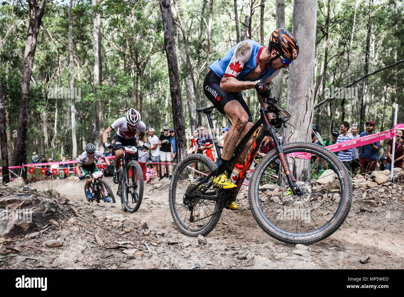 GOLD COAST, Australia - 12 aprile: Leandre BOUCHARD (possono) affronta le colline durante l'uomo Cross Country Mountain Bike il 12 aprile 2018 Foto Stock