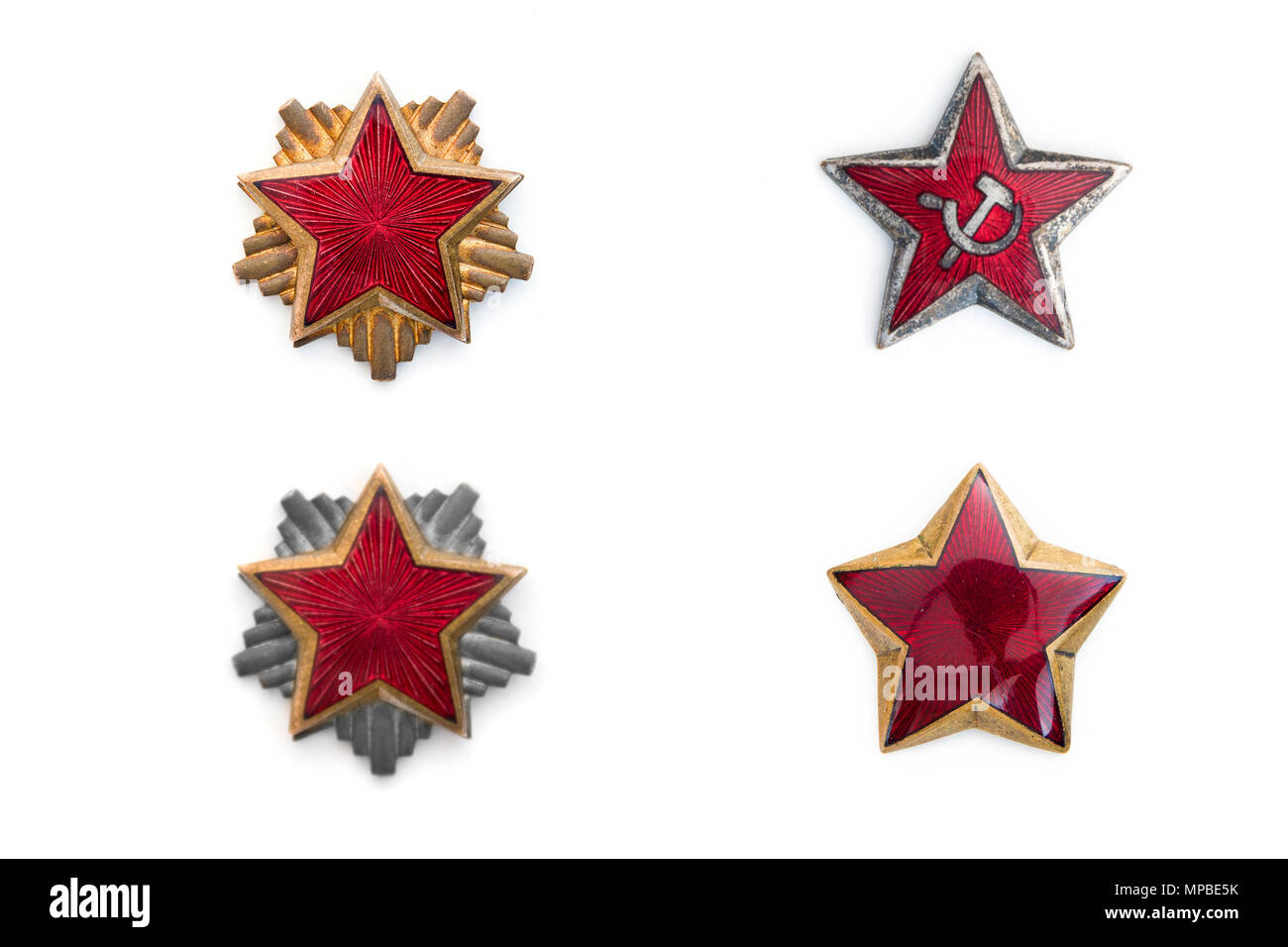 Vecchie stelle rosse da comunista cappucci militare isolato su sfondo bianco Foto Stock