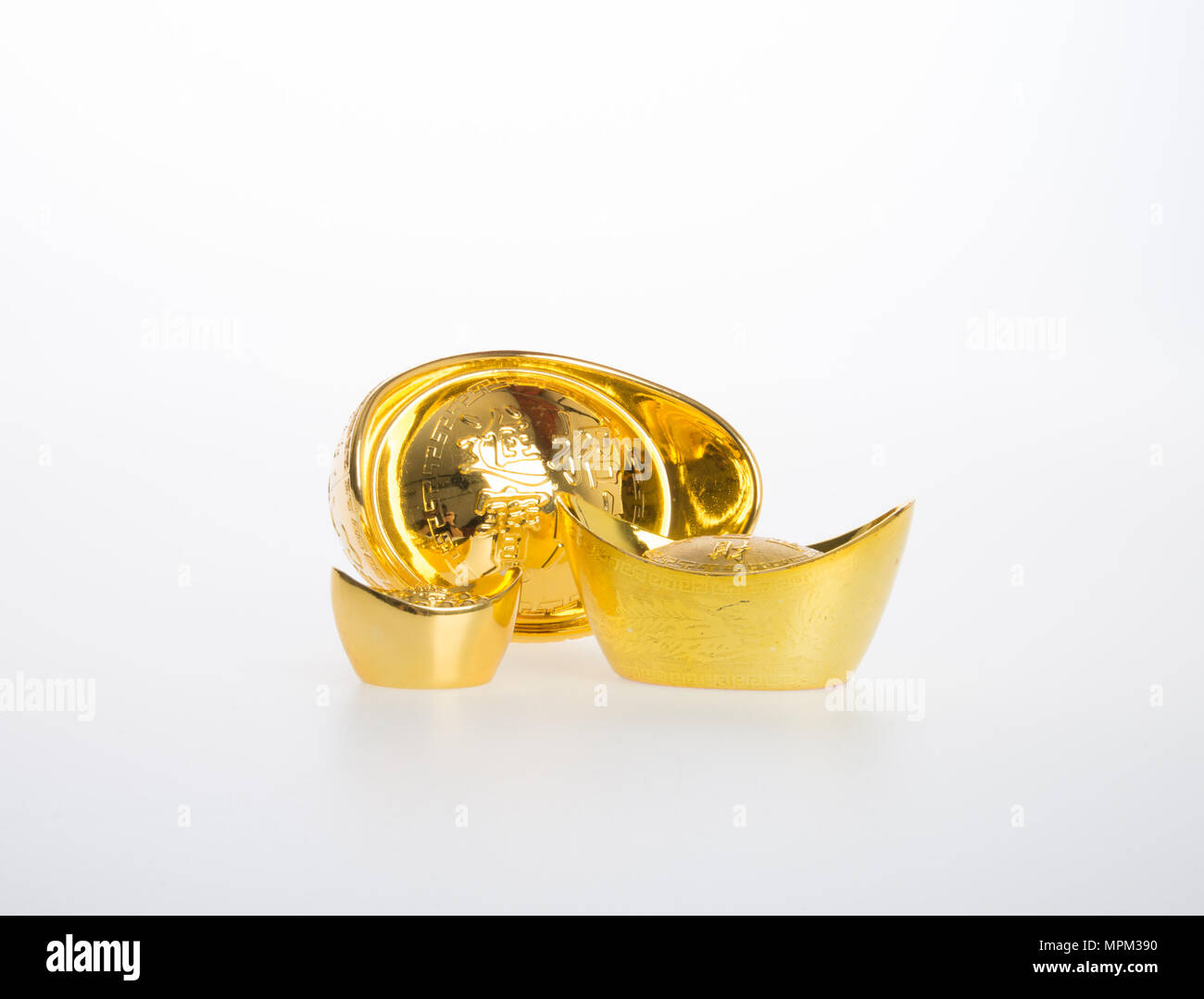 Oro o Cinese lingotto oro significa simboli di ricchezza e prosperità su uno sfondo Foto Stock