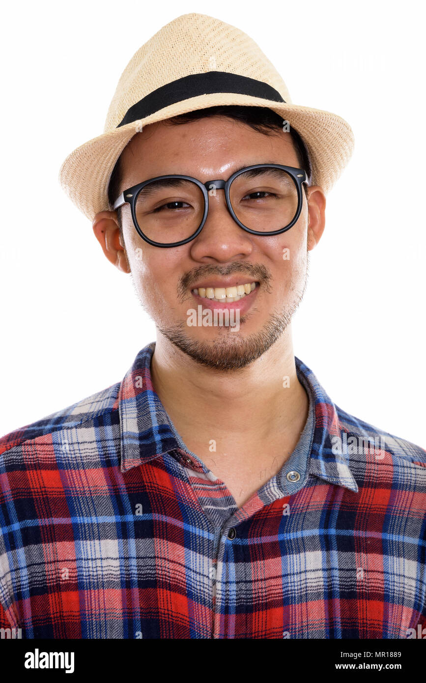 Volto di giovani asiatici felice uomo sorridente indossando occhiali di un Foto Stock