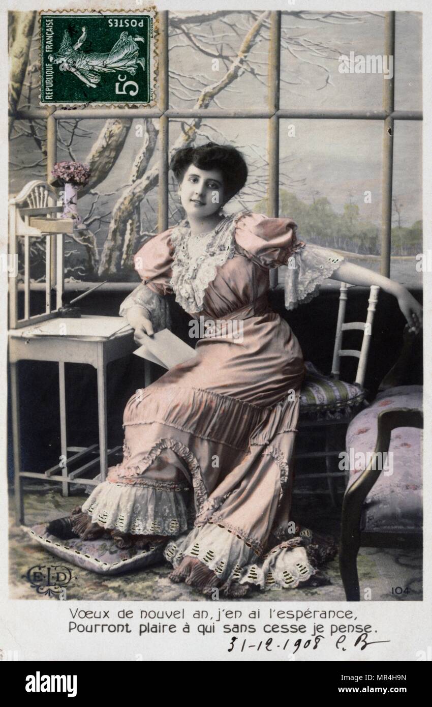 Il francese anno nuovo cartolina raffigurante un pensieroso middle class woman 1900 Foto Stock
