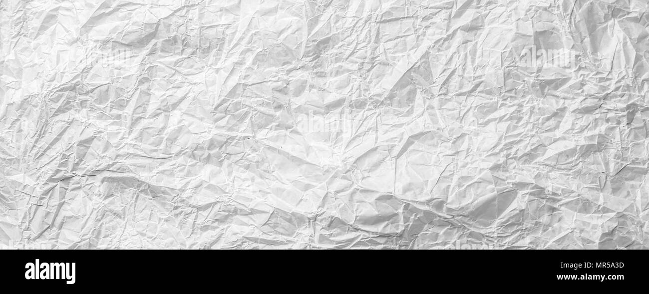 Sfondo di accartocciata bianco grigio monocromatico carta da forno materiale testurizzata per decorazione design carta da parati con spazio copia close-up Foto Stock