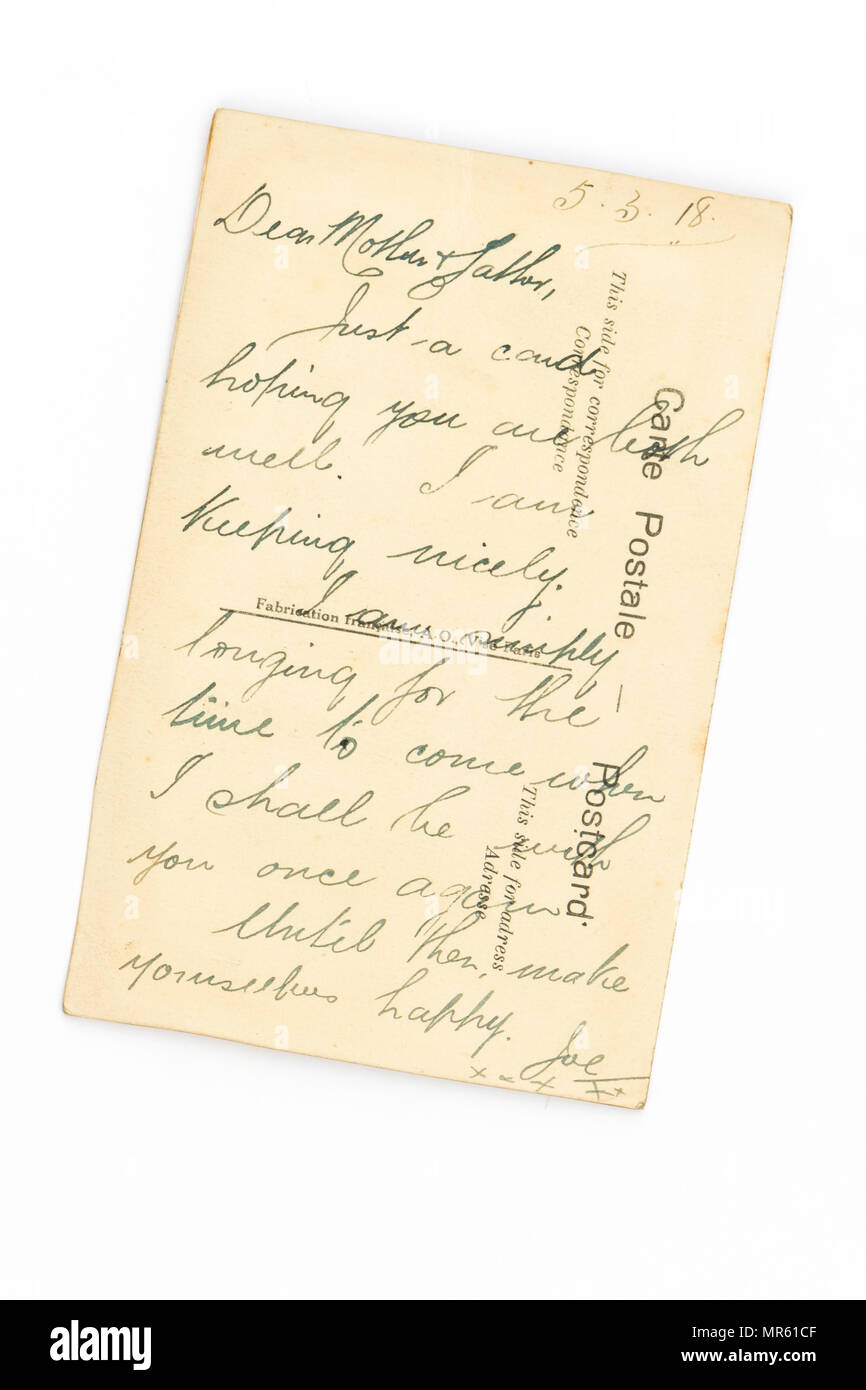 Messaggio ai genitori scritto sul retro di una prima Guerra Mondiale ricamati a mano seta cartolina - vedi immagine MR61D4 per il lato anteriore della carta Foto Stock