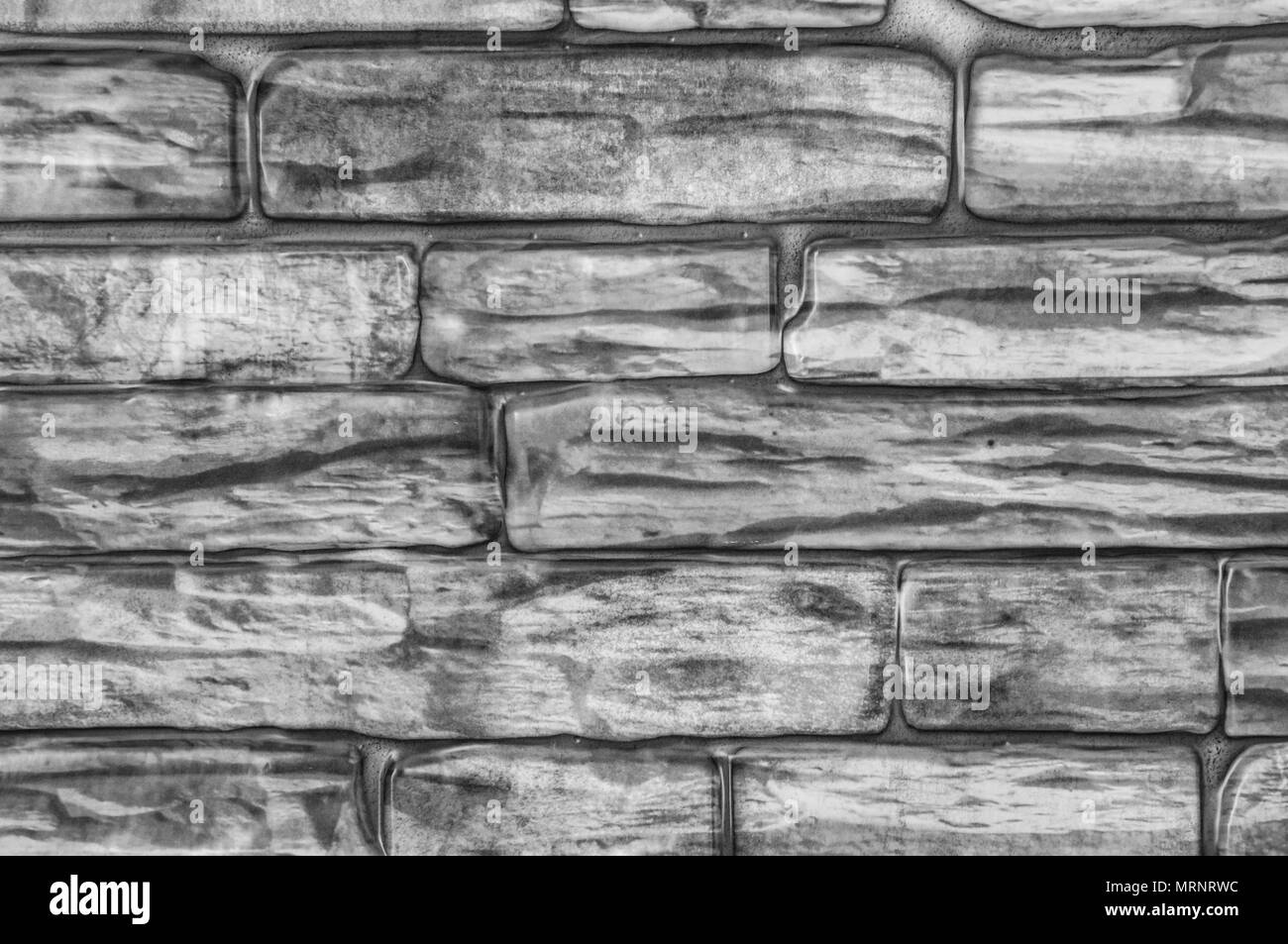 Muro di mattoni di close-up in bianco e nero. Foto Stock