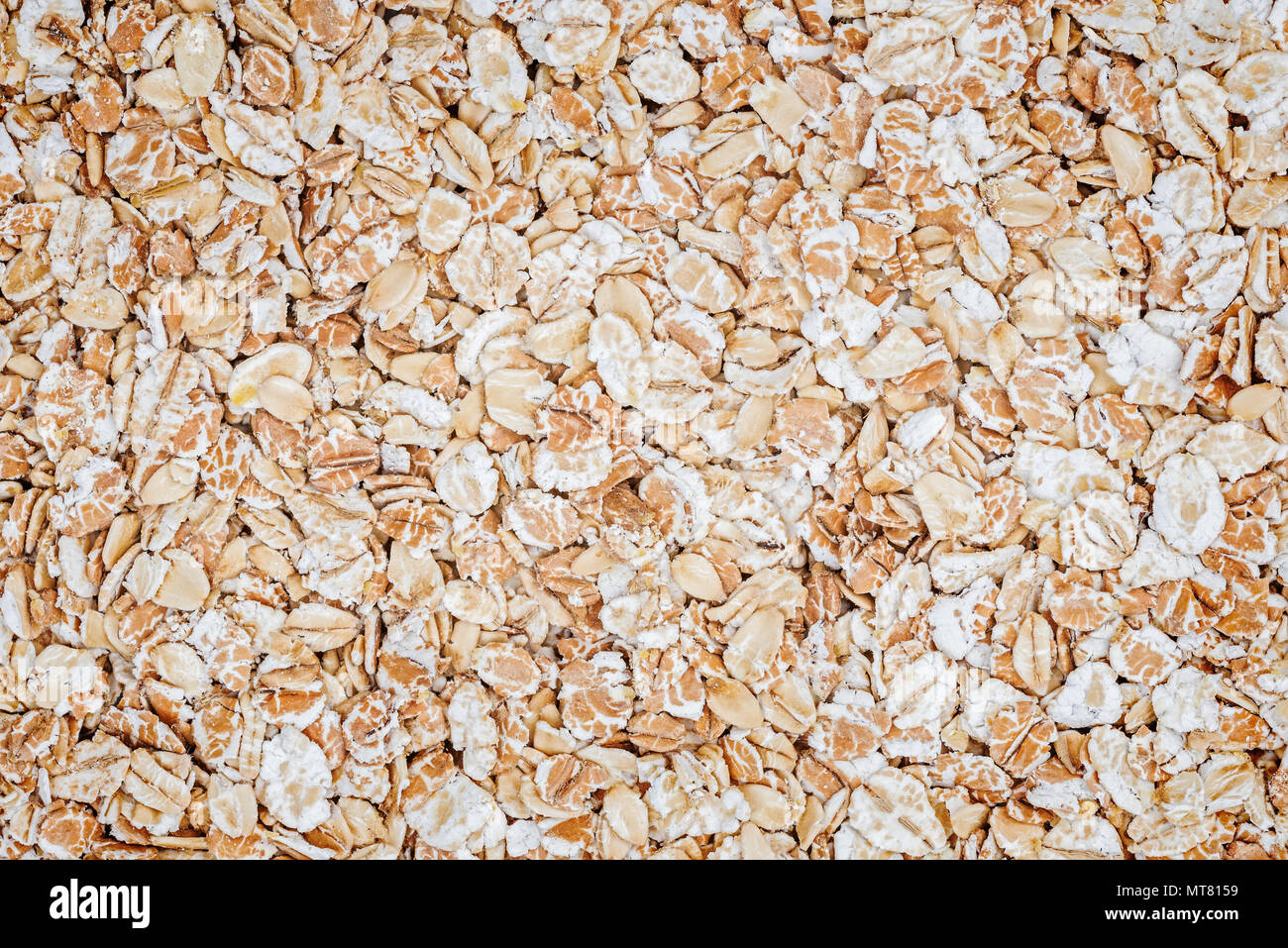 Segale fiocchi di avena grano come sfondo o texture. Dieta e nutrizione sana. Foto Stock