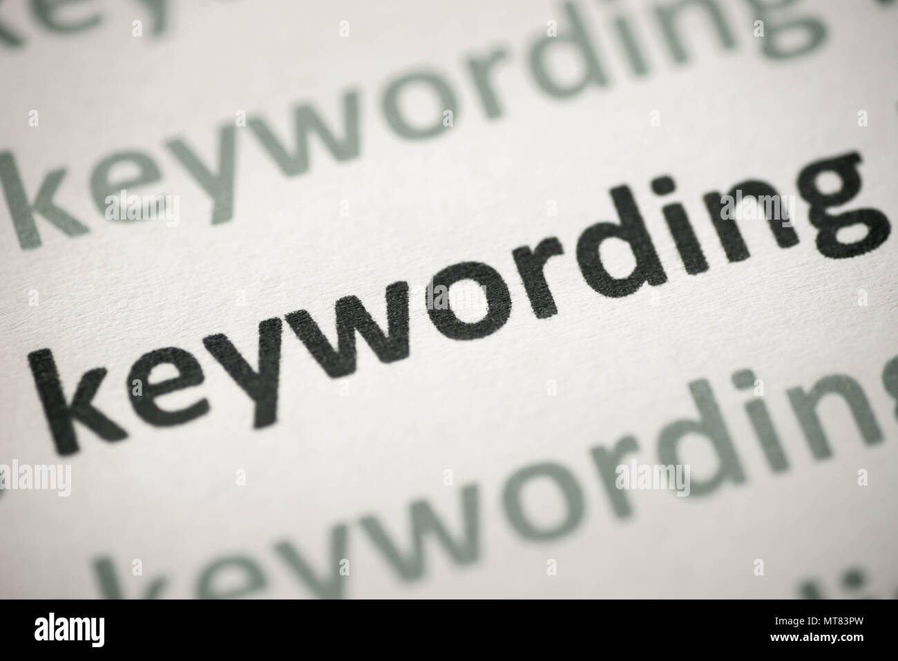 Parole chiave parola stampata su carta bianca macro Foto Stock
