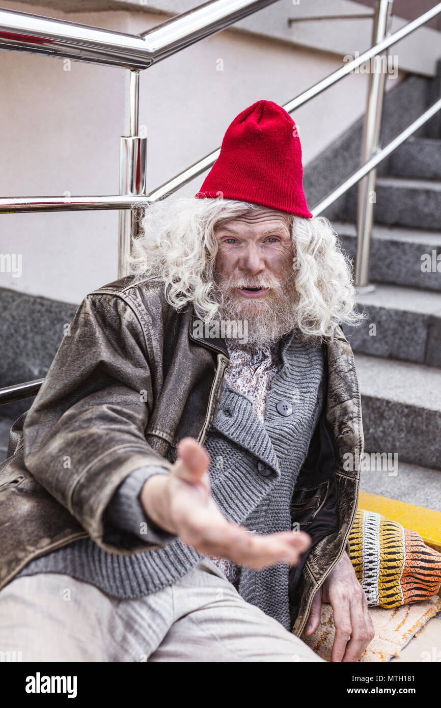 Infelice povero mendicante di denaro Foto Stock