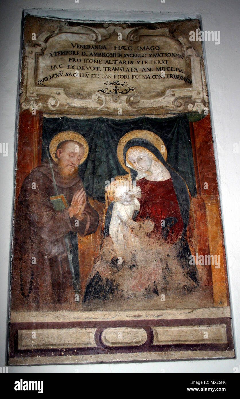 . Madonna col Bambino e San Matronianus . Italiano: Madonna col Bambino e San Matroniano. Affresco del sec. XV (la Madonna), con aggiunta nel sec. XVI (san Matroniano) nella navata della basilica di San Nazaro Maggiore a Milano. L'iscrizione latina commemora il trasporto dell'affresco dalla cappella di san Matroniano alla navata, avvenuto nel 1654. Foto di Giovanni dall'Orto, 5-5-2007. Inglese: Madonna col Bambino e San Matronianus. Xv secolo (la Madonna) e XVI secolo (Saint Matronianus) affresco nella navata centrale di San Nazaro Maggiore basilica di Milano. L'iscrizione latina commemora Foto Stock