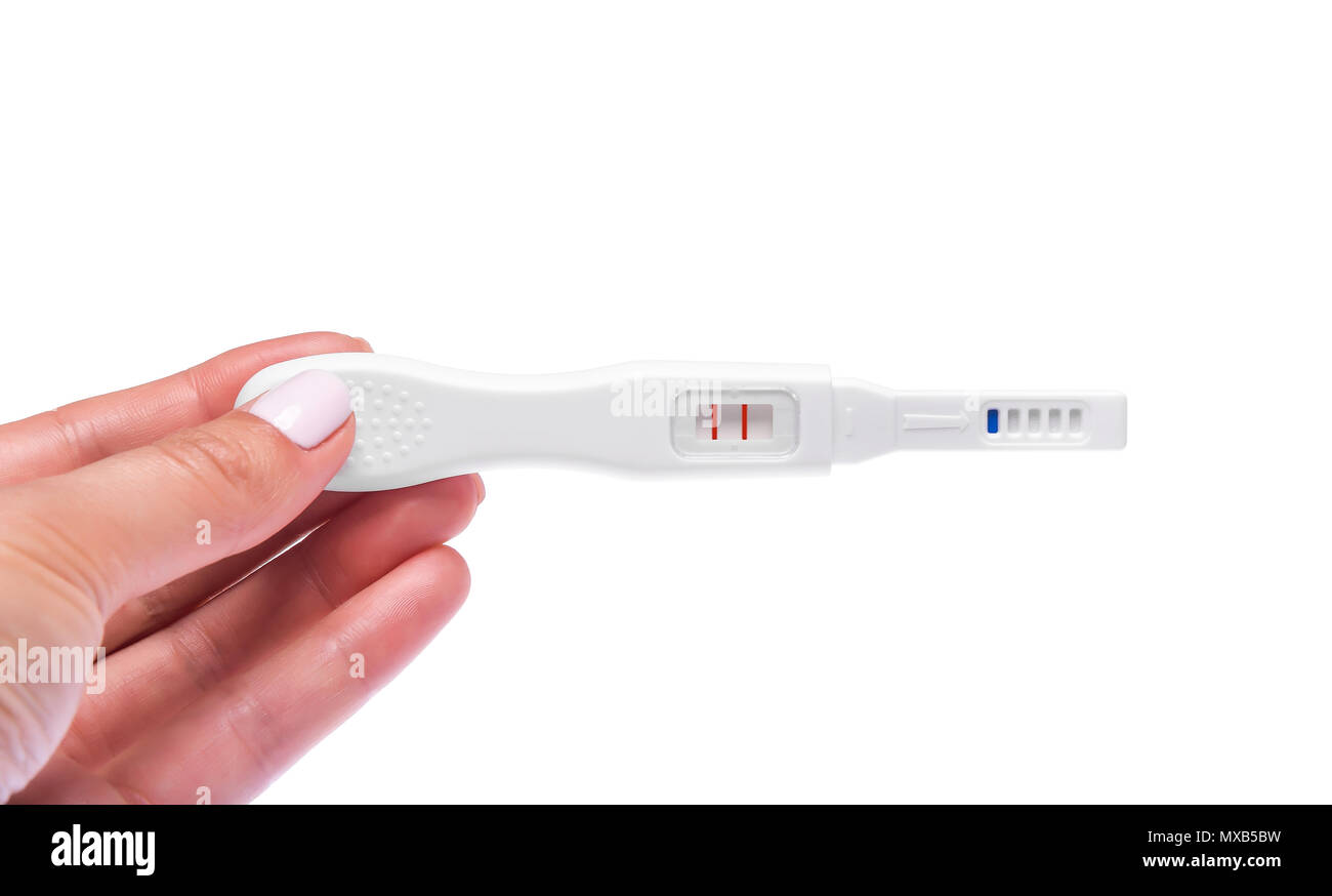 In mano un test di gravidanza. Foto Stock