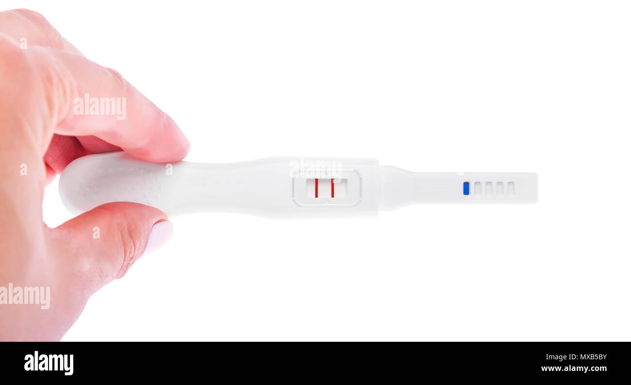 In mano un test di gravidanza. Foto Stock