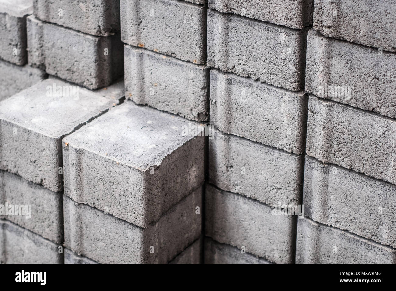 Di ciottoli di pietra, materiale da costruzione , impilate le pietre della pavimentazione Foto Stock