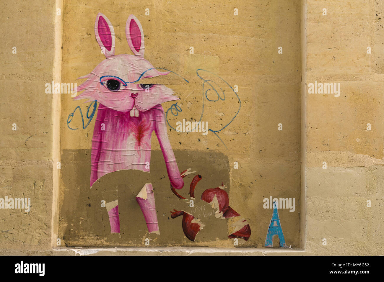 Street Art sticker - coniglio rosa parete adesivo. Foto Stock
