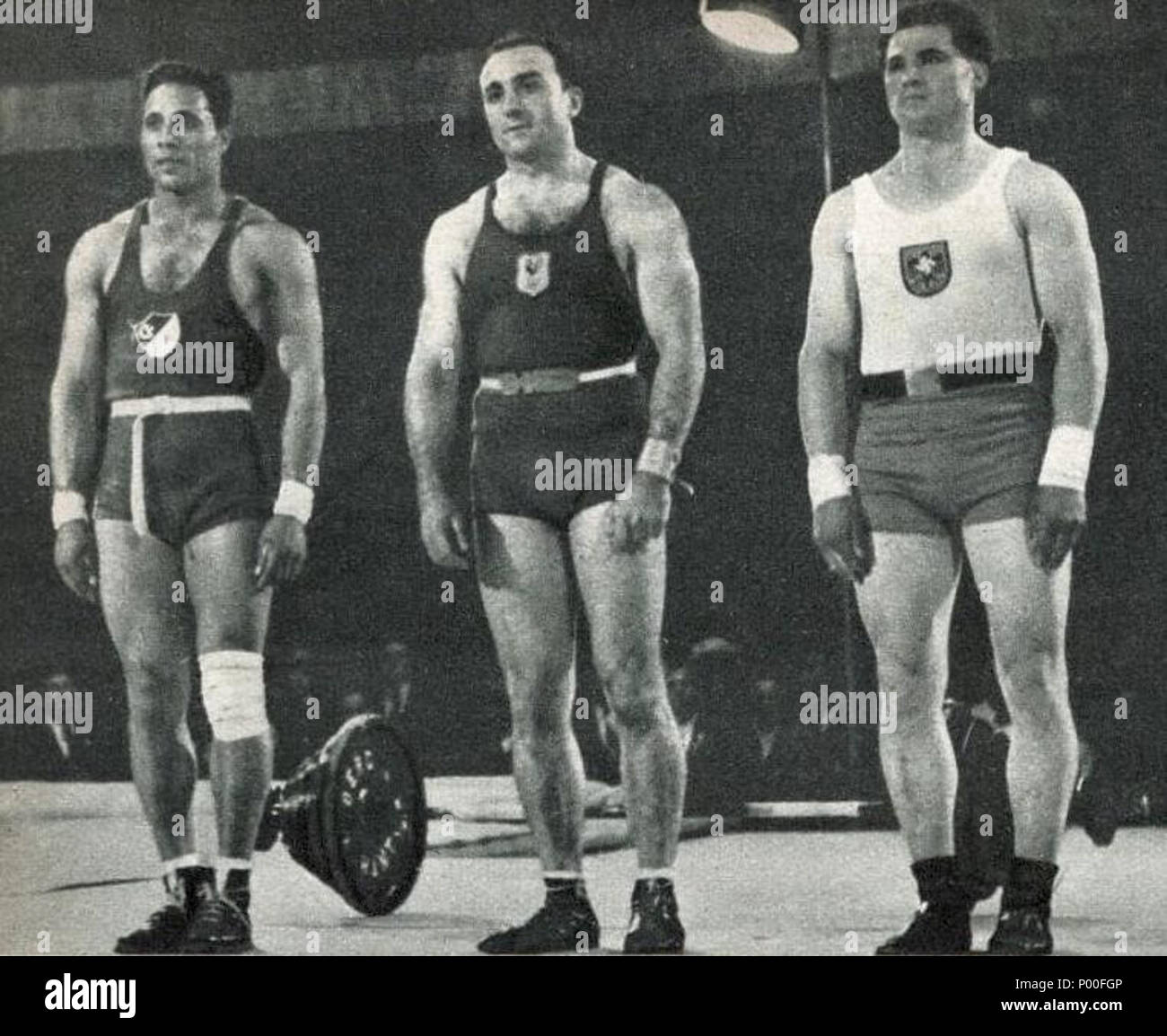 64 Louis Hostin Champion olympique 1936 d'halthérophilie (G. l'égyptien Wasil 3e; D. l'allemand Deutsch 2e) Foto Stock