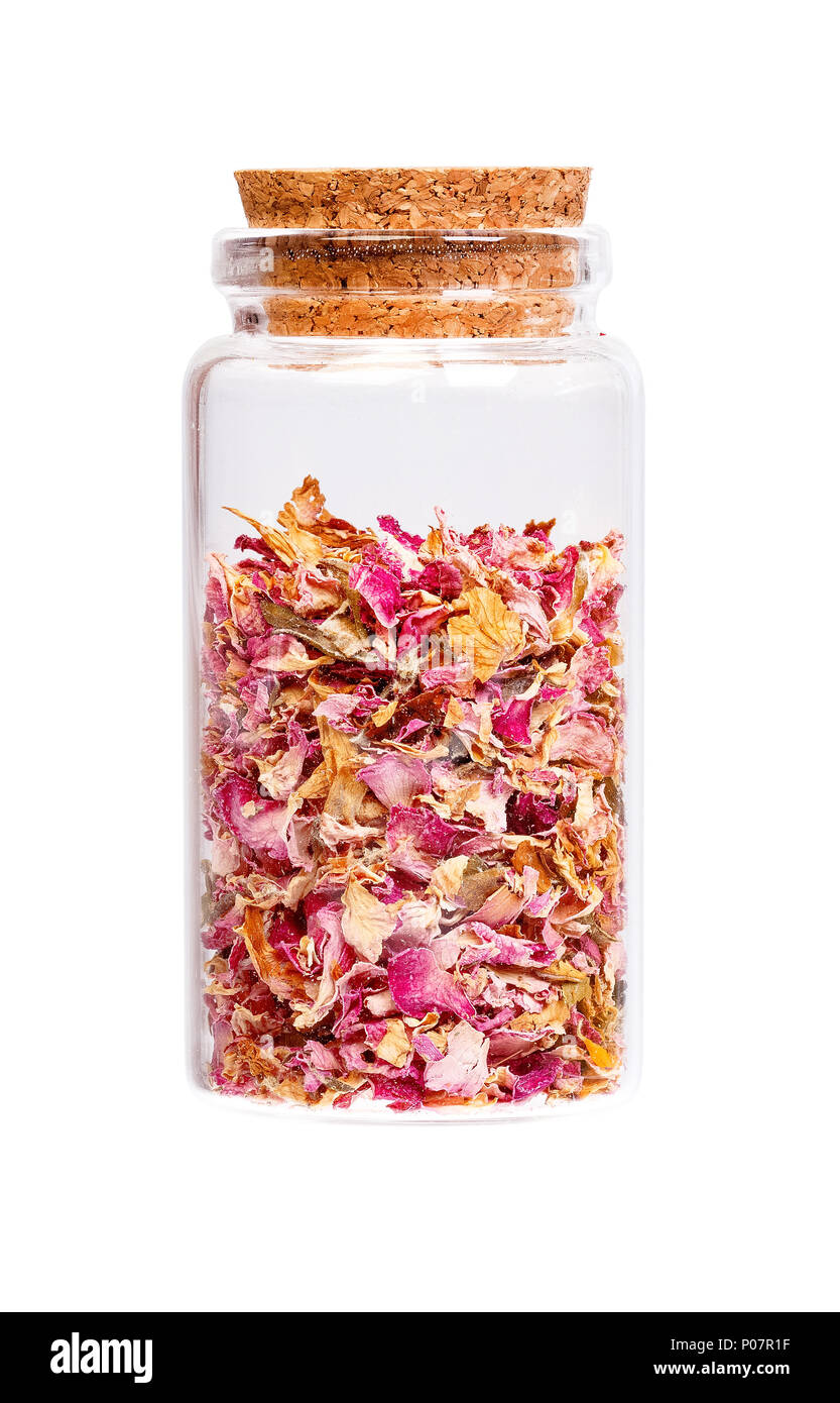 Essiccati petali di rosa in una bottiglia con tappo di sughero per uso medico. Foto Stock