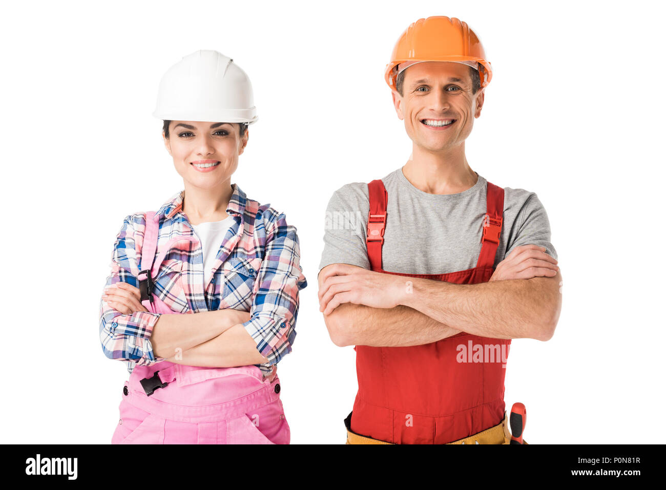 Sorridente costruttori professionali di un uomo e di una donna isolato su bianco Foto Stock