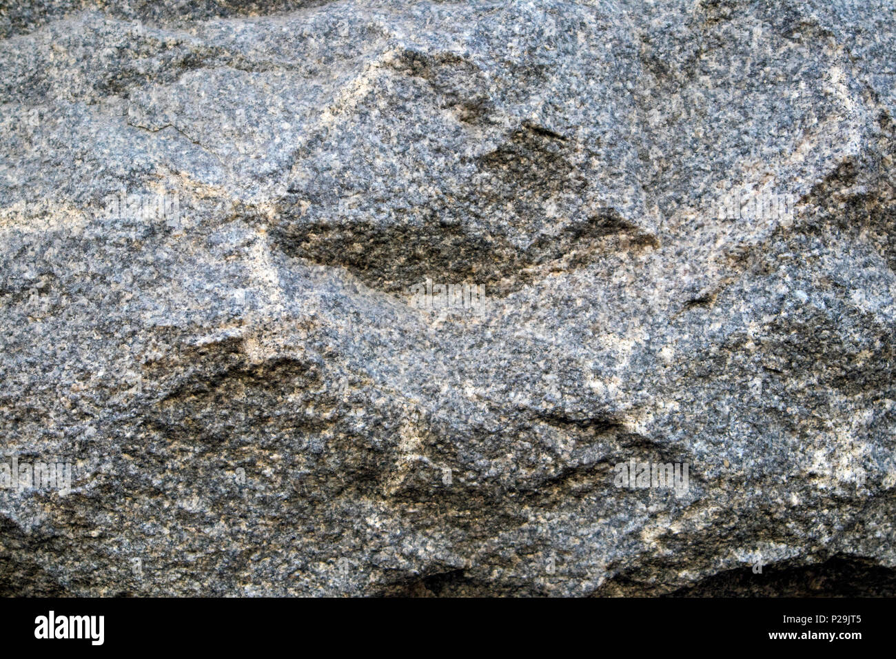 Grigio pietra naturale texture, rilievo di superficie in granito, può essere utilizzato come sfondo Foto Stock